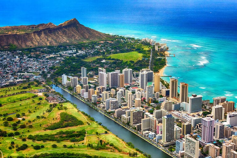 Aerial view of Waikiki and Diamond Head, with the ocean and canal visible