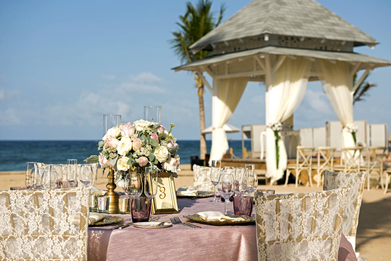 Beach wedding dining tables set up