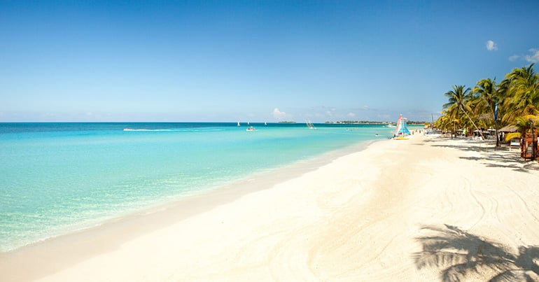 An expansive smooth white beach in Jamaica