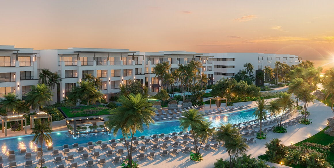 Distance rendering of a low-rise white resort with a long pool and rows of sun loungers at sunset