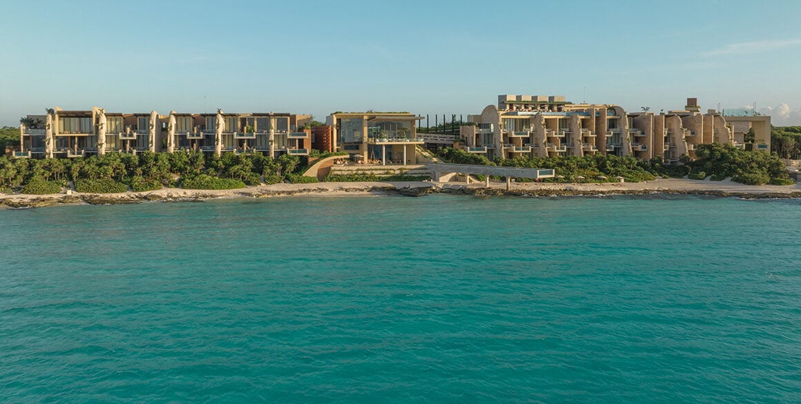 View of a boutique beachfront resort from the water