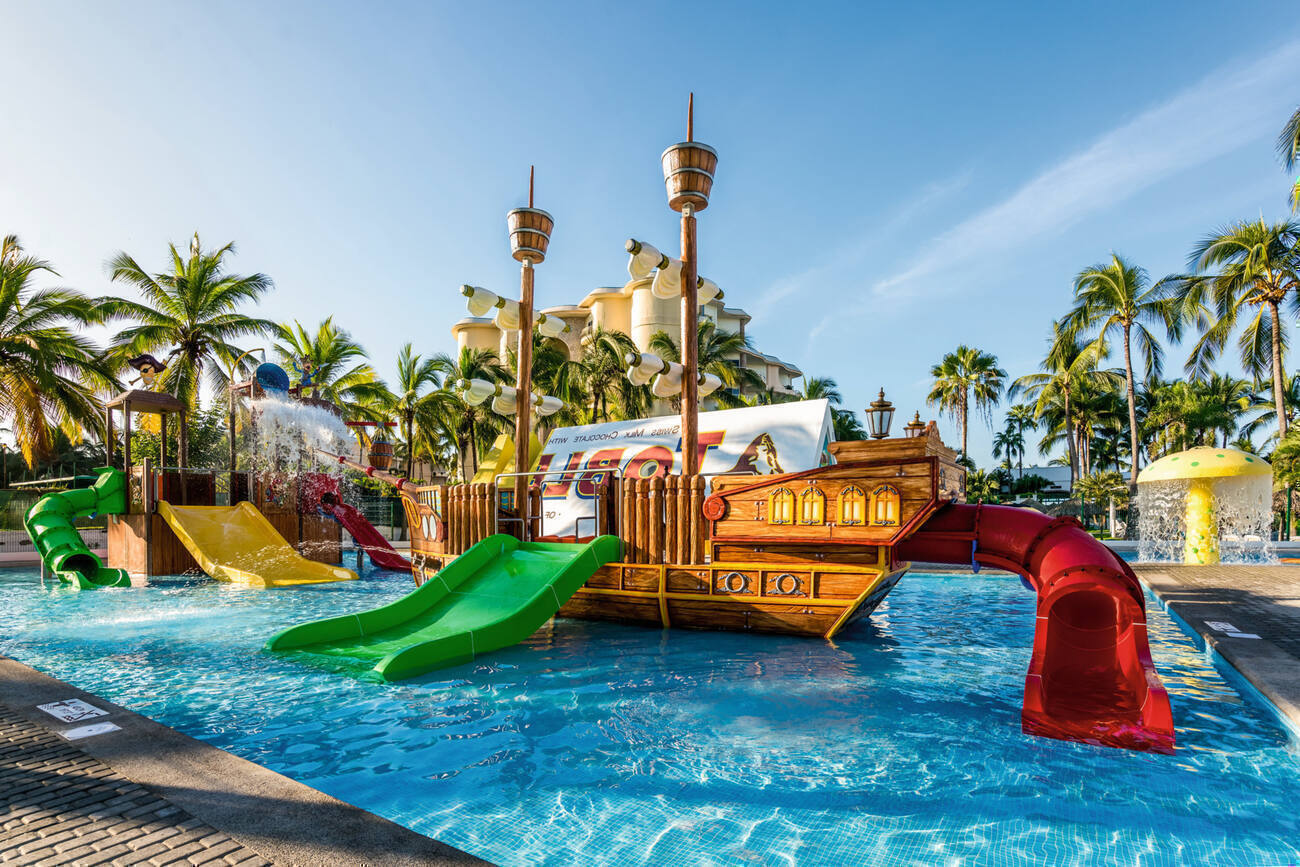 Waterpark with slides and a ship