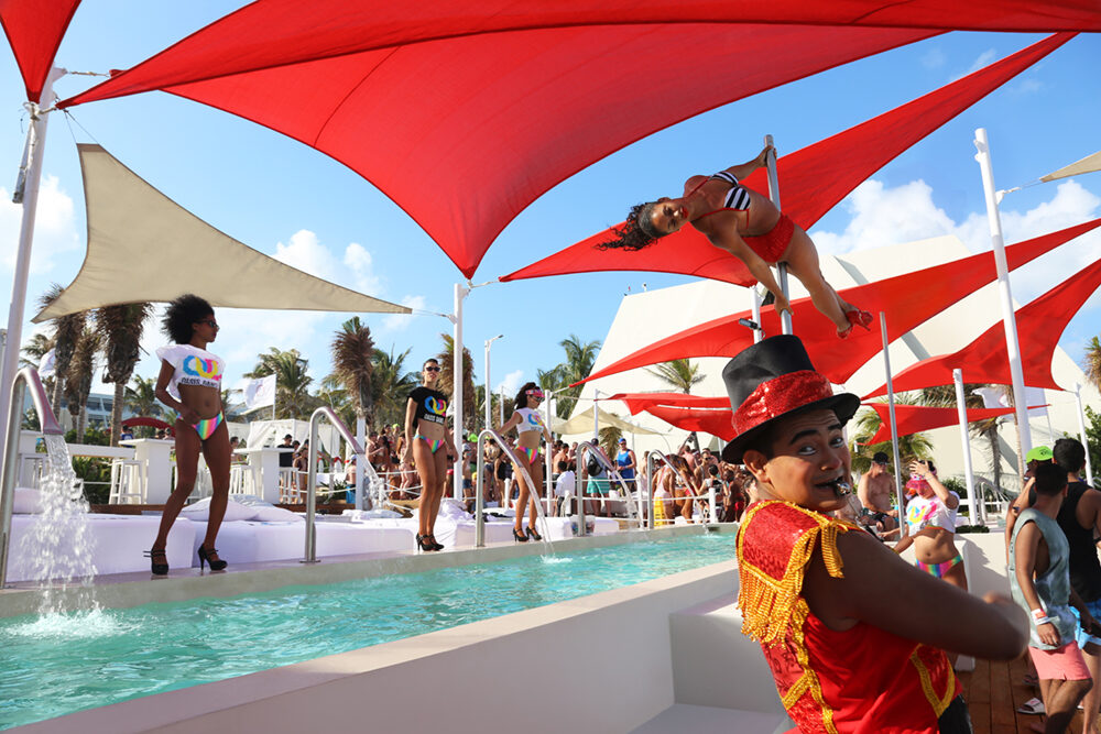 Dancers performing at a pool party